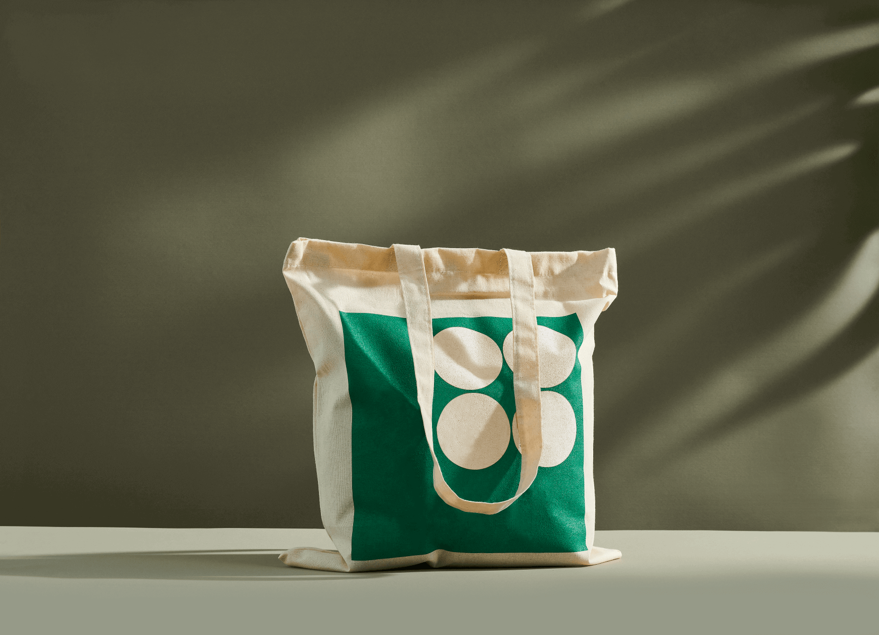 Light beige organic cotton tote bag with green print