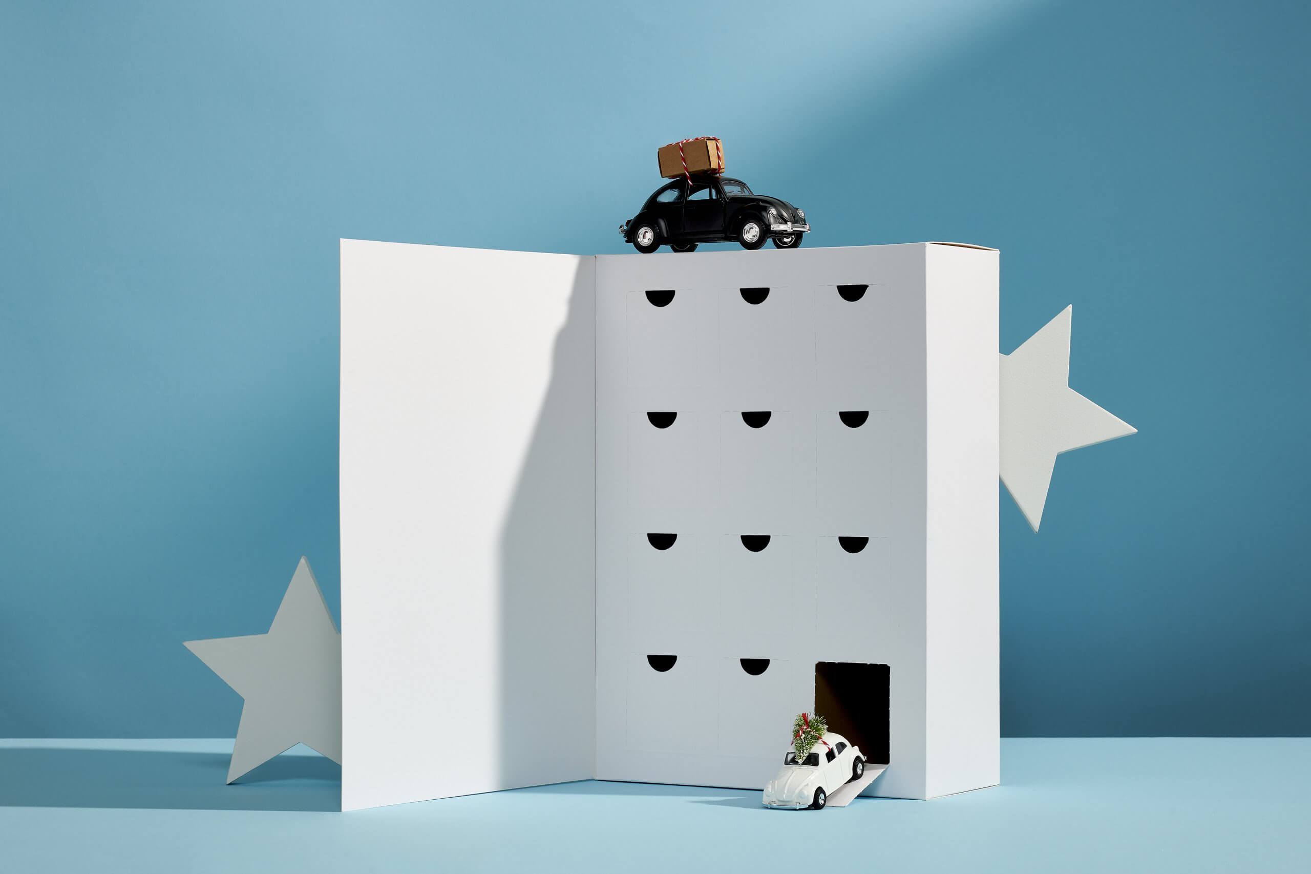 Cardboard advent calendar box with toy cars